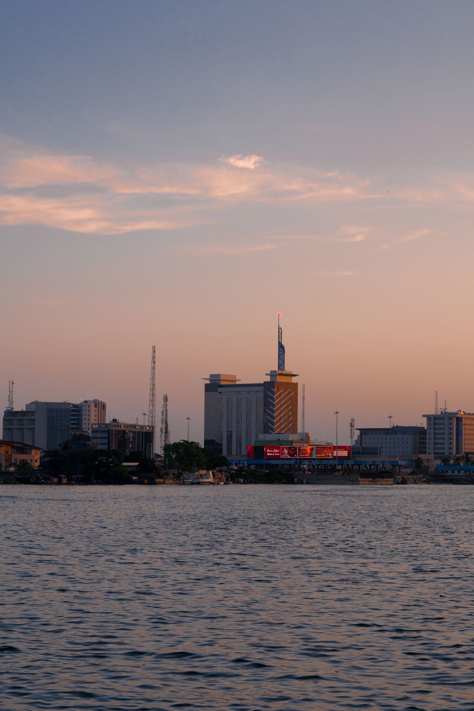 Lagos Island at sunset, seen from the water.